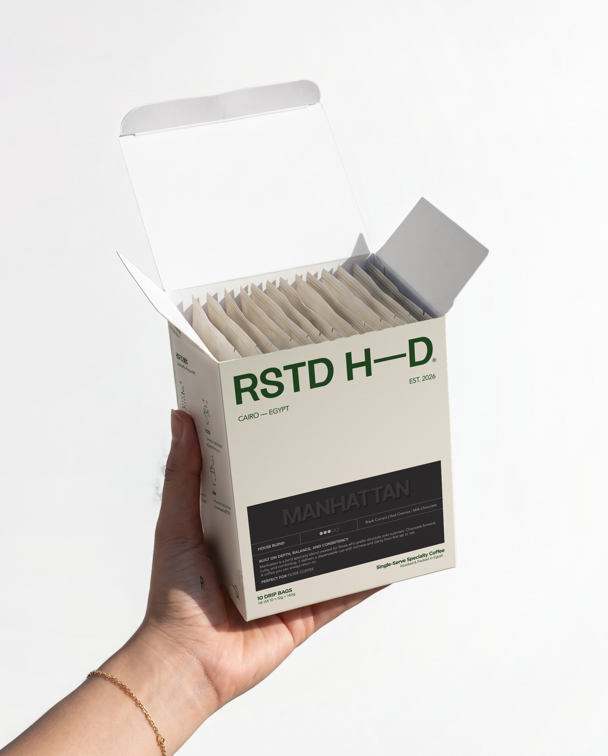Manhattan house blend drip-bag box, held in hand