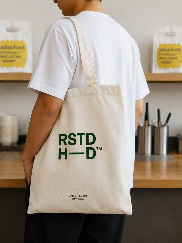 Roasted Head canvas tote — worn over the shoulder